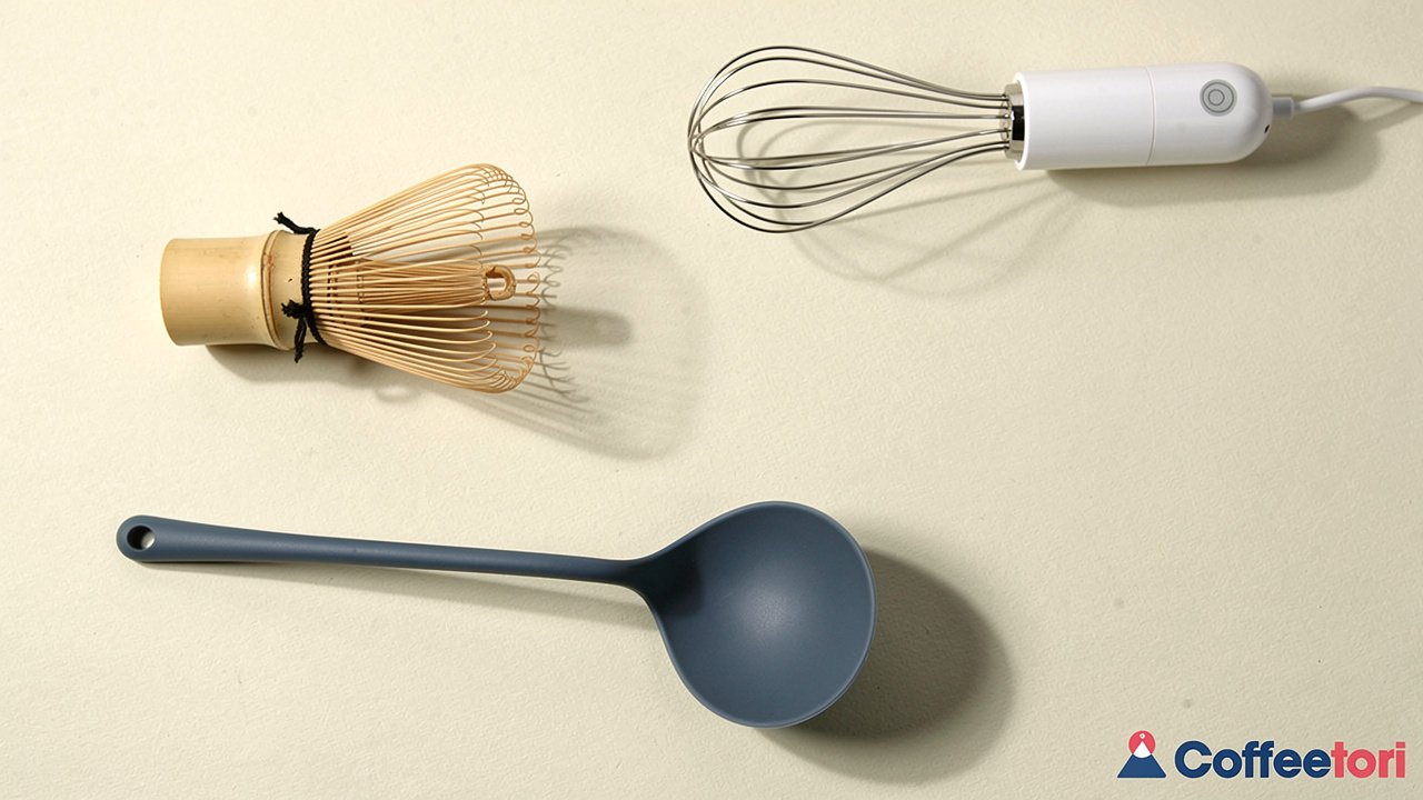 Four different types of matcha whisks arranged showing bamboo, wire, electric, and silicone options